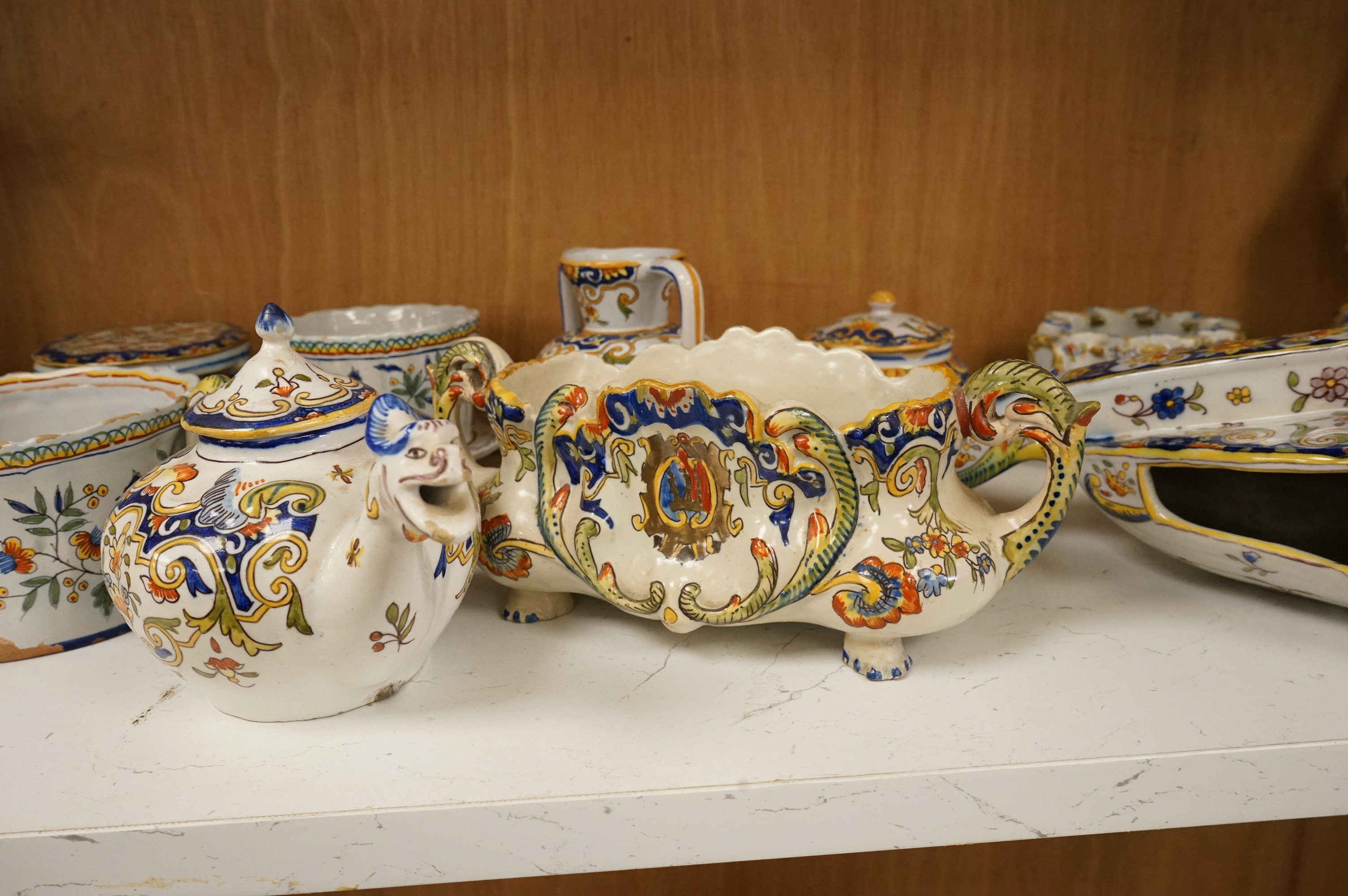 A group of French faience pottery to include trinket boxes, a teapot and vases, largest 32cm in length